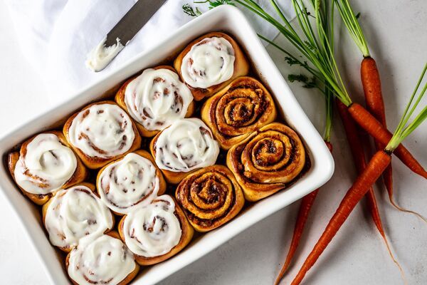 C&H® Light Brown Sugar carrot cake cinnamon rolls with vanilla icing made with C&H® Powdered Sugar